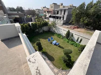 1 Kanal bangla-style house for sale in Wapda Town with lawn